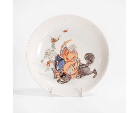 A Chinese famille rose dish, Qing dynasty (1644-1911), of circular form, painted with Zhong Kui, the demon queller, with a bu