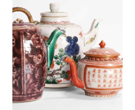 A collection of three Chinese and Japanese export teapots, 18th/19th century, comprising:one famille verte, the bell-shaped b