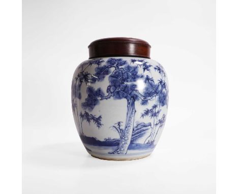 A Chinese blue and white jar, in the Kangxi style, of ovoid form, painted with prunus, pine and bamboo, 21.5cm high, associat