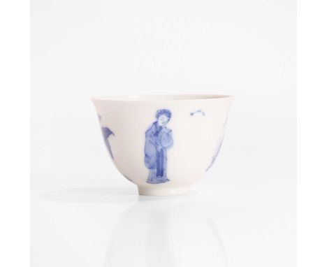 A Chinese blue and white cup, Kangxi (1662-1722), the rounded sides rising from a circular foot to a flared rim, painted with