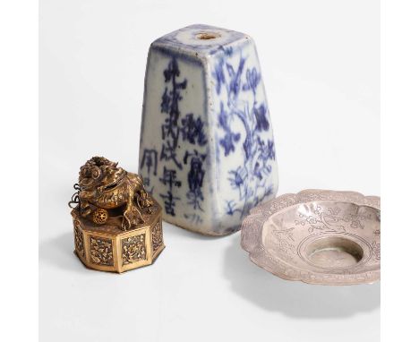 A Chinese silver-gilt box and cover, Qing dynasty (1644-1911), of octagonal form, with a Buddhist lion playing with a ball, s
