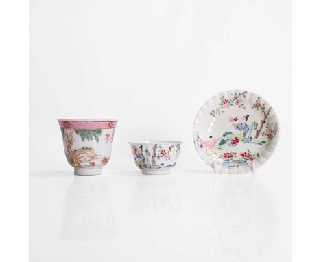 A Chinese famille rose cup and saucer, 18th century, each of lobed form, painted with a lady and a boy in a garden, cup 7.5cm