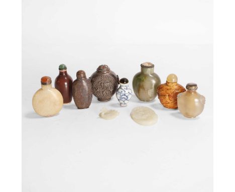 A collection of Chinese snuff bottles, late Qing dynasty, in silver, porcelain, agate, or hardstone, 5 to 7cm high, and two j