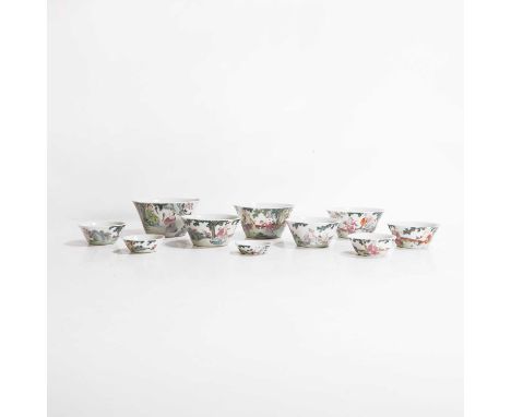 A set of ten Chinese famille rose wine cups, early 19th century, each tapering body rising to a flared rim, painted with Daoi