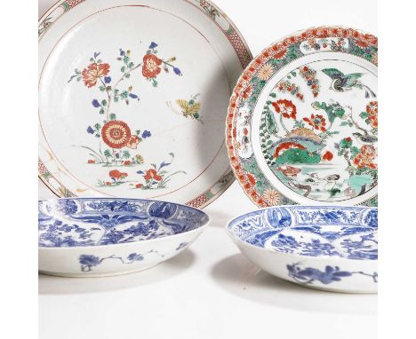A pair of Chinese blue and white dishes, Kangxi (1662-1722), each of circular form, painted with birds and flowers in shaped 