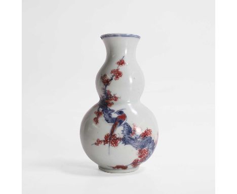 A Chinese iron-red and underglaze blue wall vase, 20th century, in the shape of a double gourd with a flat back, painted with