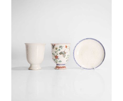 A collection of Chinese export porcelain, 18th century, comprising two cups and a saucer, decorated with butterflies and flow