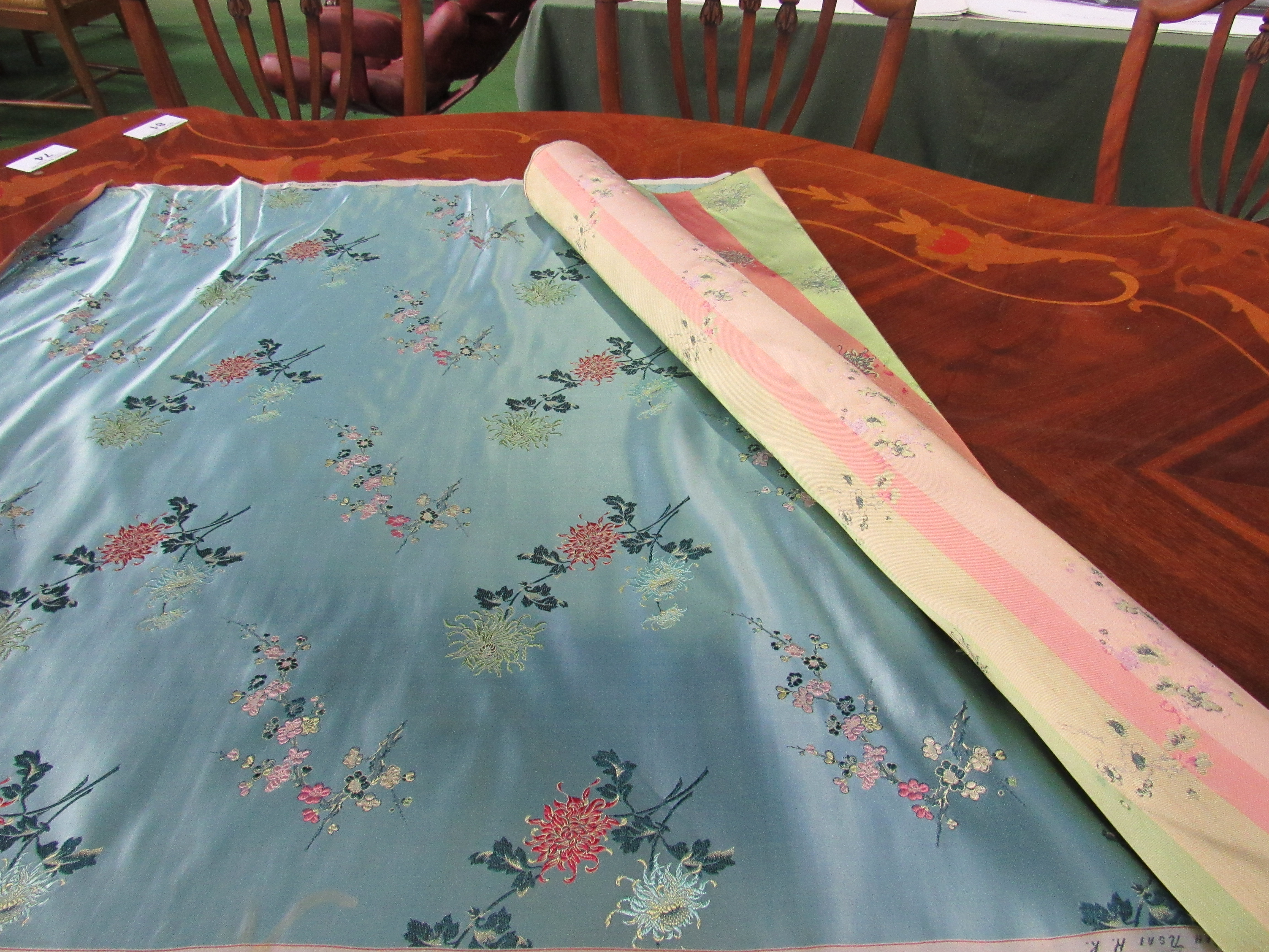 A roll of Chinese silk by WAH NGAI. Width 76cms. Estimate £50100.