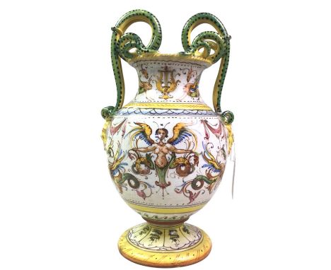 REPRODUCTION MAJOLICA VASE, AND A REPRODUCTION GOLDSCHEIDER FIGURE the vase in yellow and green with twin handles, decorated 
