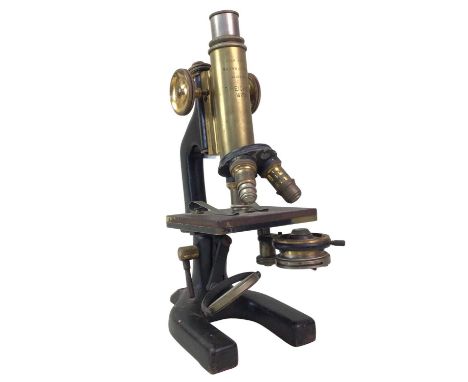 BRONZED BRASS MONOCULAR MICROSCOPE, C. REICHERT OF VIENNA with three revolving lenses and a group of field medical instrument