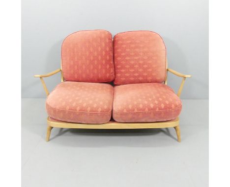 A mid-century Ercol Windsor 203 beech two-seater sofa in Golden Dawn finish, with blue maker's label. Overall 133x78x80cm, se