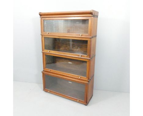 An early 20th century mahogany Globe-Wernicke four shelf sectional bookcase. 87x140x30cm. 