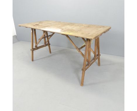 A vintage pine folding trestle table. 131x68x68cm. 