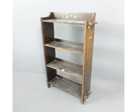 An Arts & Crafts style oak bookcase, with four fixed shelves. 66x100x20cm. 