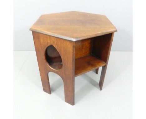 An Arts & Crafts oak hexagonal bookcase table attributed to Liberty & Co. 60x56x52cm. 