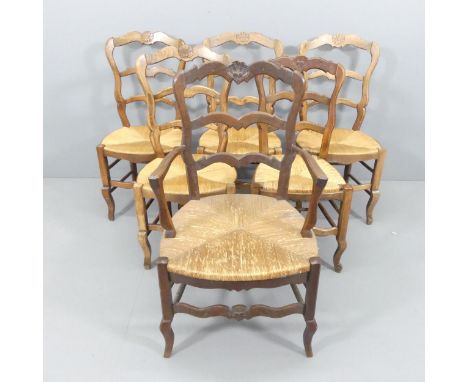 A set of six French oak rush-seated ladder-back dining chairs (5+1). 