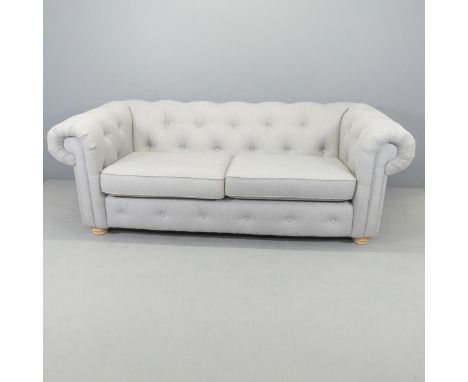 A modern button-back upholstered Chesterfield style three-seater sofa. Overall 210x75x102cm, seat 148x46x60cm. 