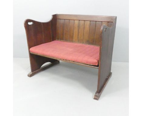 An Arts &amp; Crafts oak bench in the manner of George Walton. 96x70x60cm.