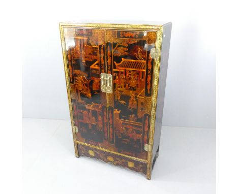 A Chinese black lacquered two-door armoire with shelf fitted interior and all-over painted decoration. 92x152x42cm.Good used 