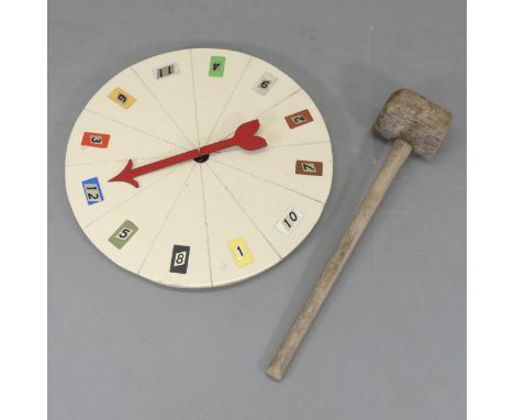 A vintage fairground strongman's hammer, length 90cm, and roulette wheel, diameter 77cm. (2) 