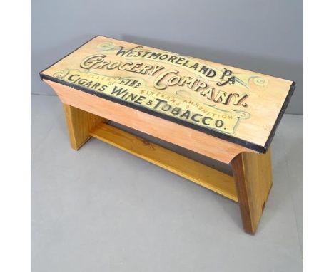CLIVE FREDRIKSSON - A painted pine bench of small size, with painted lettering for Westmoreland Grocery Company. 83x47x34cm. 
