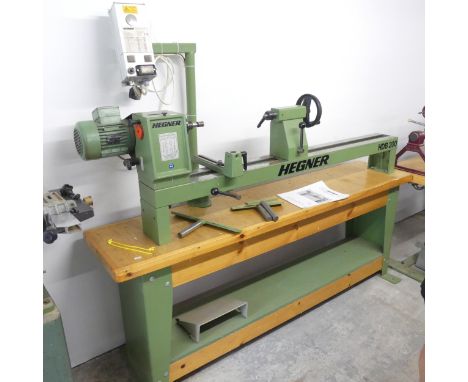 A HEGNER HBD 200 Woodturning lathe, with original instruction manual. 180x160x50cm. 