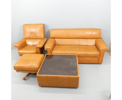 A mid-century brown leather upholstered four-piece lounge suite, comprising a two seater sofa, 178x83x92cm, a swivel armchair