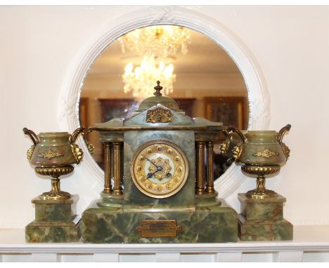 Early twentieth century Continental green onyx and gilt metal mounted clock garniture of architectural form with presentation
