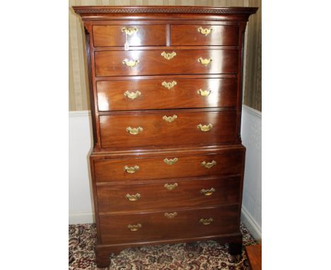 George III mahogany chest on chest with dentil cornice and two short over three long graduated drawers between canted fluted 