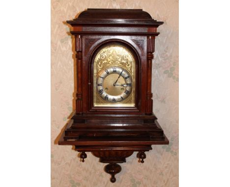 Edwardian walnut bracket clock with arched gilded dial and silvered chapter ring, 45cm high, on associated bracket 