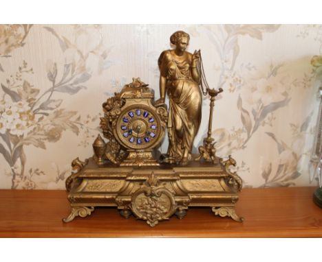 Late nineteenth century Continental gilt spelter mantel clock with figure surmount, on stepped ornate plinth base, 41cm wide 