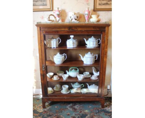 Late Victorian rosewood display cabinet with pierced brass gallery and shelved interior enclosed by glazed door and sides on 