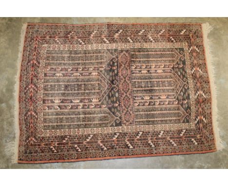 Eastern part silk rug, ochre field with two panels of architectural ornament in geometric borders, 100cm x 80cm