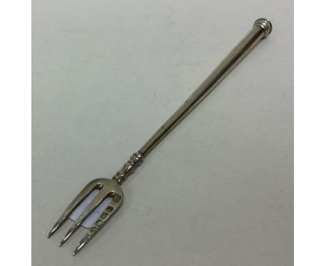 A Victorian silver tapering pickle fork. London 1876. Approx. 10 grams. Est. £15 - £20.
