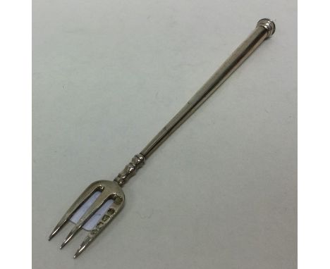 A Victorian silver tapering pickle fork. London 1876. Approx. 10 grams. Est. £15 - £20.