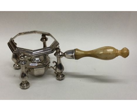 A rare George I side handled teapot stand on cast body with matching burner. London 1714. Britannia Standard. By Nathaniel Lo