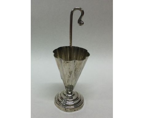 A Continental silver cocktail stick holder in the form of an opening umbrella. Approx. 32 grams. Est. £25 - £30.