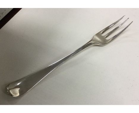 An early mid 18th Century three prong silver fork. Punched verso. Approx. 60 grams. Est. £50 - £80.