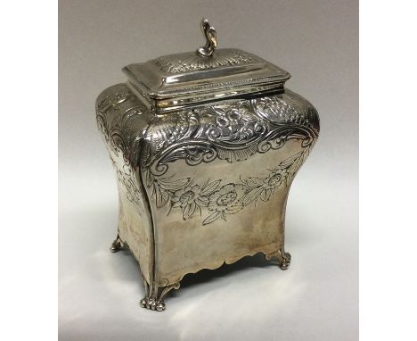 A shaped Georgian silver tea caddy on scroll feet with lift-off cover. London 1761. Approx. 179 grams. Est. £600 - £800.