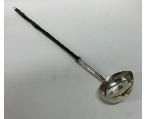 A large George II silver toddy ladle with whalebone handle. London 1736. Approx. 102 grams. Est. £80 - £120.