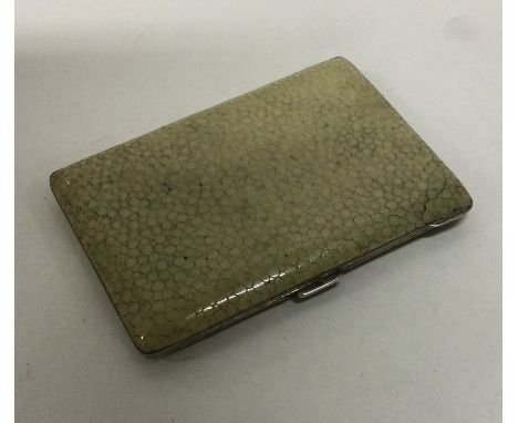 A heavy shagreen and silver cigarette case with gilt interior. Approx. 85 grams. Est. £80 - £120.