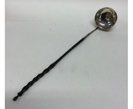 A Georgian silver toddy ladle with whalebone handle. Approx. 40 grams. Est. £30 - £50.