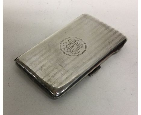 A heavy silver engine turned card case with gilt interior. Birmingham. Approx. 74 grams. Est. £40 - £60.
