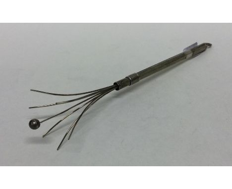 An Edwardian silver swizzle stick. Approx. 5 grams. Est. £30 - £40. 