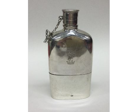 An attractive Victorian silver hip flask with removable base revealing gilt interior to crested side. Birmingham 1862. By Alf