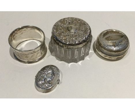 A silver engraved napkin ring together with an embossed silver box etc. Various dates and makers. Approx. 127 grams. Est. £40