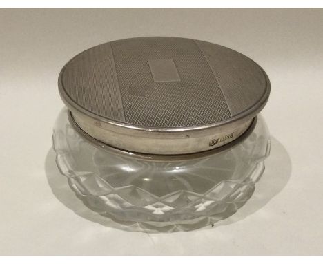 A good quality engine turned silver and glass mounted dressing table jar. Birmingham. Est. £30 - £50.