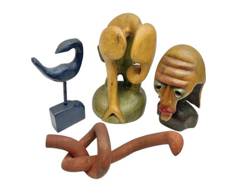 Helen Skelton (British 1933 – 2023): Four carved wooden abstract sculptures, including a bird, knot, face and abstract tree, 