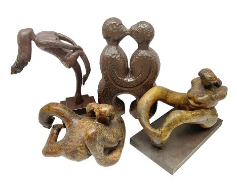 Helen Skelton (British 1933 – 2023): Four carved wooden abstract sculptures, each modelled as a figure with a adzed finish, l