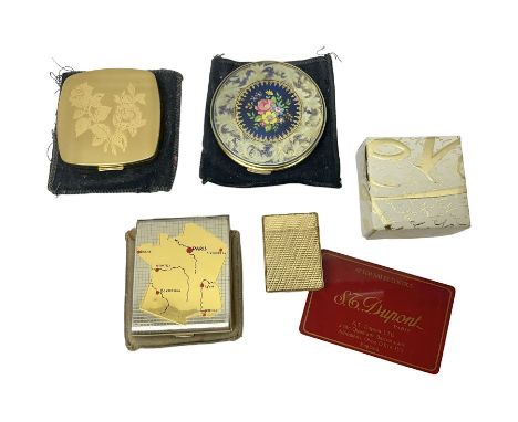 St Dupont gold plated cigarette lighter, with engine turned decoration, serial no EW1279, together with three powder compacts